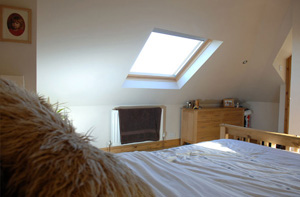 Bed and TV in loft conversion